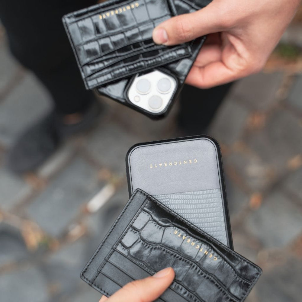 Leather iPhone Case Lizard Pattern "A man and a woman holding luxury iPhone 15 Pro cases from the luxury brand Gentcreate.