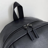 Close-up picture of zipper on black leather backpack from Gentcreate.