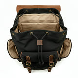 Black backpack with brown accents on a white background