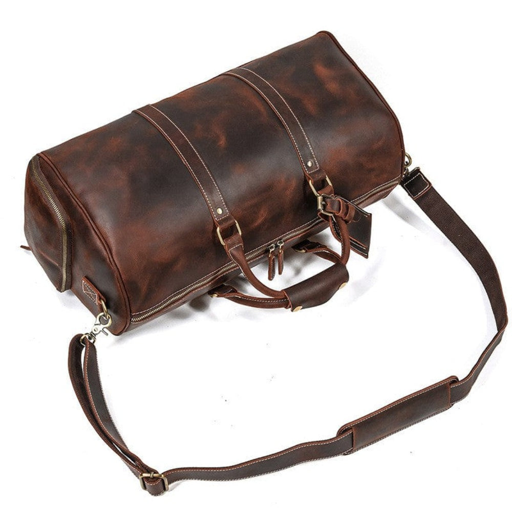 Crossbody-veske i brunt skinn Mørk brun lær duffle bag sidevisning fra luksusmerket Gentcreate