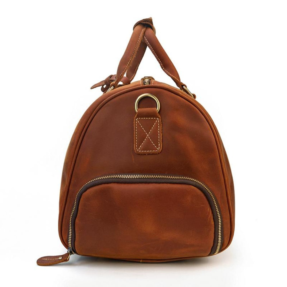 Crossbody-veske i brunt skinn Visning av sko rommet med glidelås på en lær duffle bag