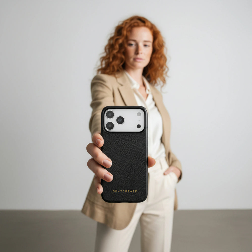Woman holding a black phone case with 'GENTLEBEAR' branding against a plain background