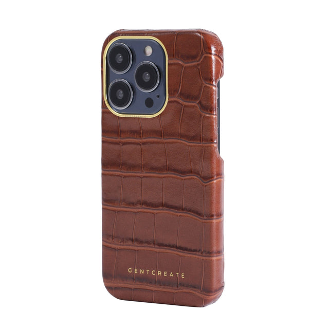 젠트크리에이트 브랜드의 브라운 크로커다일 아이폰 케이스, 왼쪽 측면에서 촬영됨.