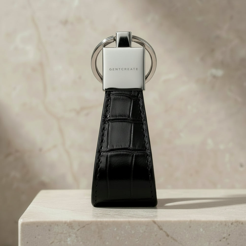 Black crocodile-patterned keychain with GENTCREATE logo