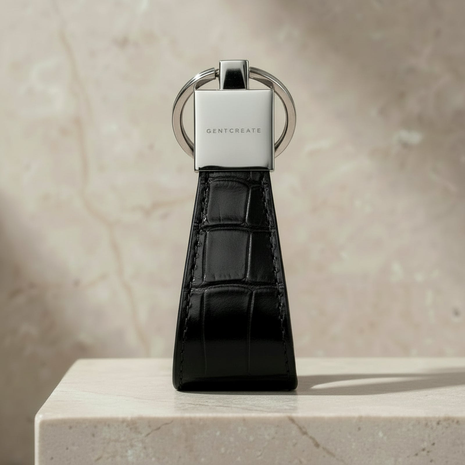 Black crocodile-patterned keychain with GENTCREATE logo