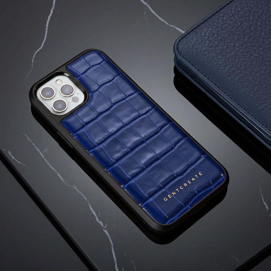 Blue crocodile-patterned phone case on a dark surface with 'GENTCREATE' branding.