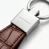 Brown crocodile full-grain leather keychain with a silver GENTCREATE logo on a white background