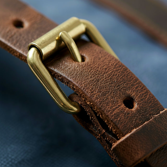 Macro photography of blue canvas retro backpack by GENTCREATE