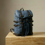 Navy blue hiking backpack with brown straps by GENTCREATE