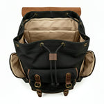 Black backpack with brown accents on a white background