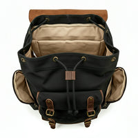 Black backpack with brown accents on a white background