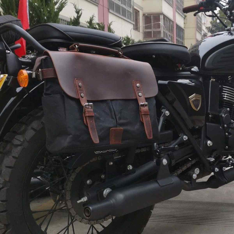 Black Motorcycle Bag with Brown Top Made of Leather Attached to Motorcycle