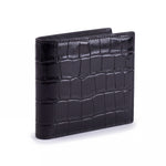 Closed black crocodile-embossed leather bifold wallet by GENTCREATE standing on white