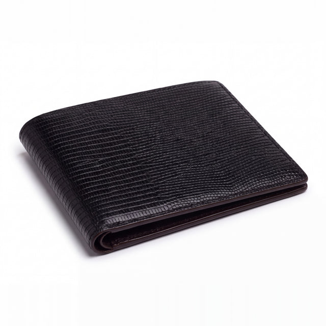 Closed black lizard-embossed leather bifold wallet by GENTCREATE lying on white