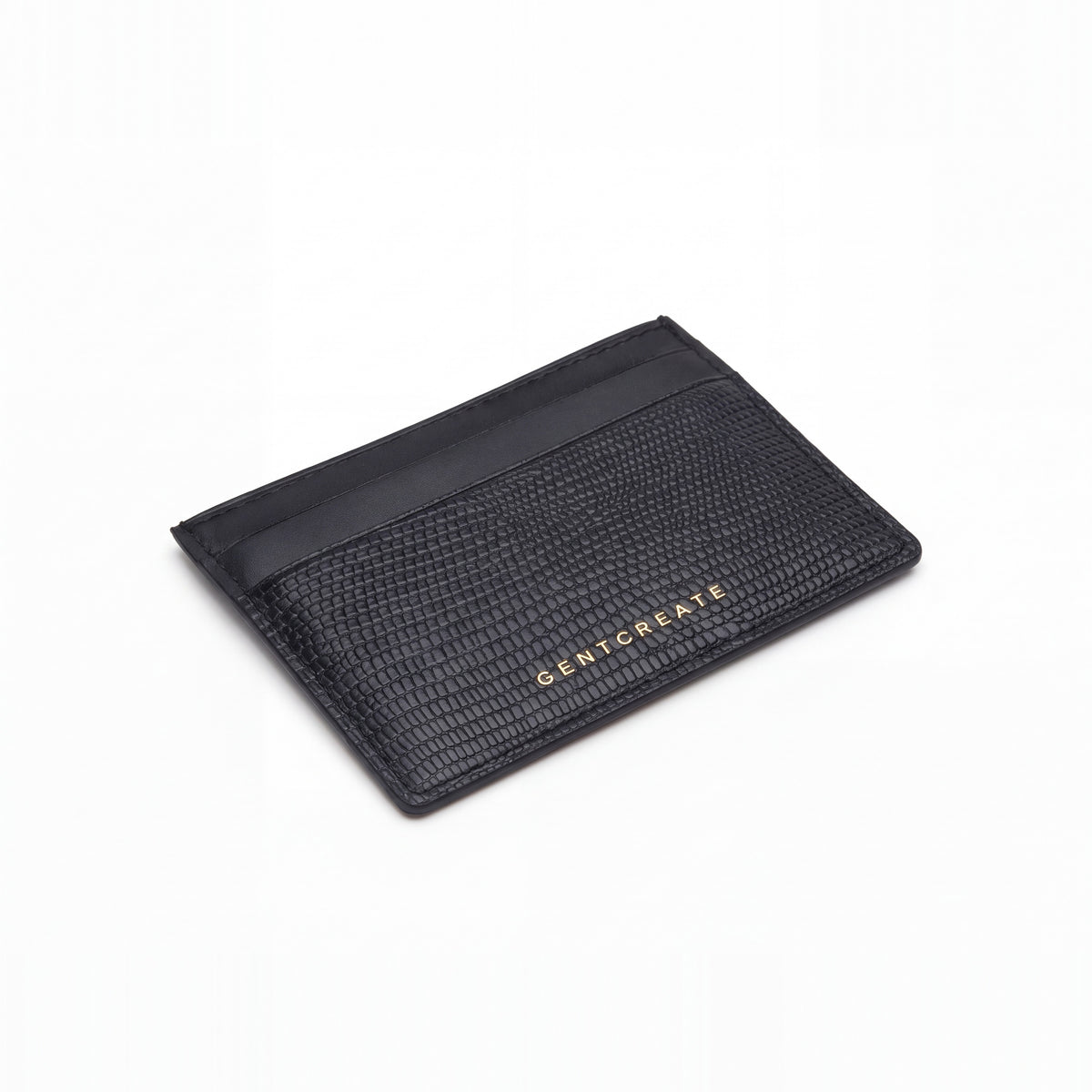 Black lizard-embossed leather business card holder by GENTCREATE lying at an angle on white