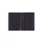 Open black lizard-embossed leather passport holder by GENTCREATE showing the passport sleeve and card slots, on white