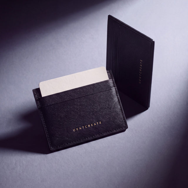 Black Saffiano leather card holder by GENTCREATE with a card, studio still life