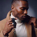 Man heading out with house keys on a black Saffiano leather keychain by GENTCREATE