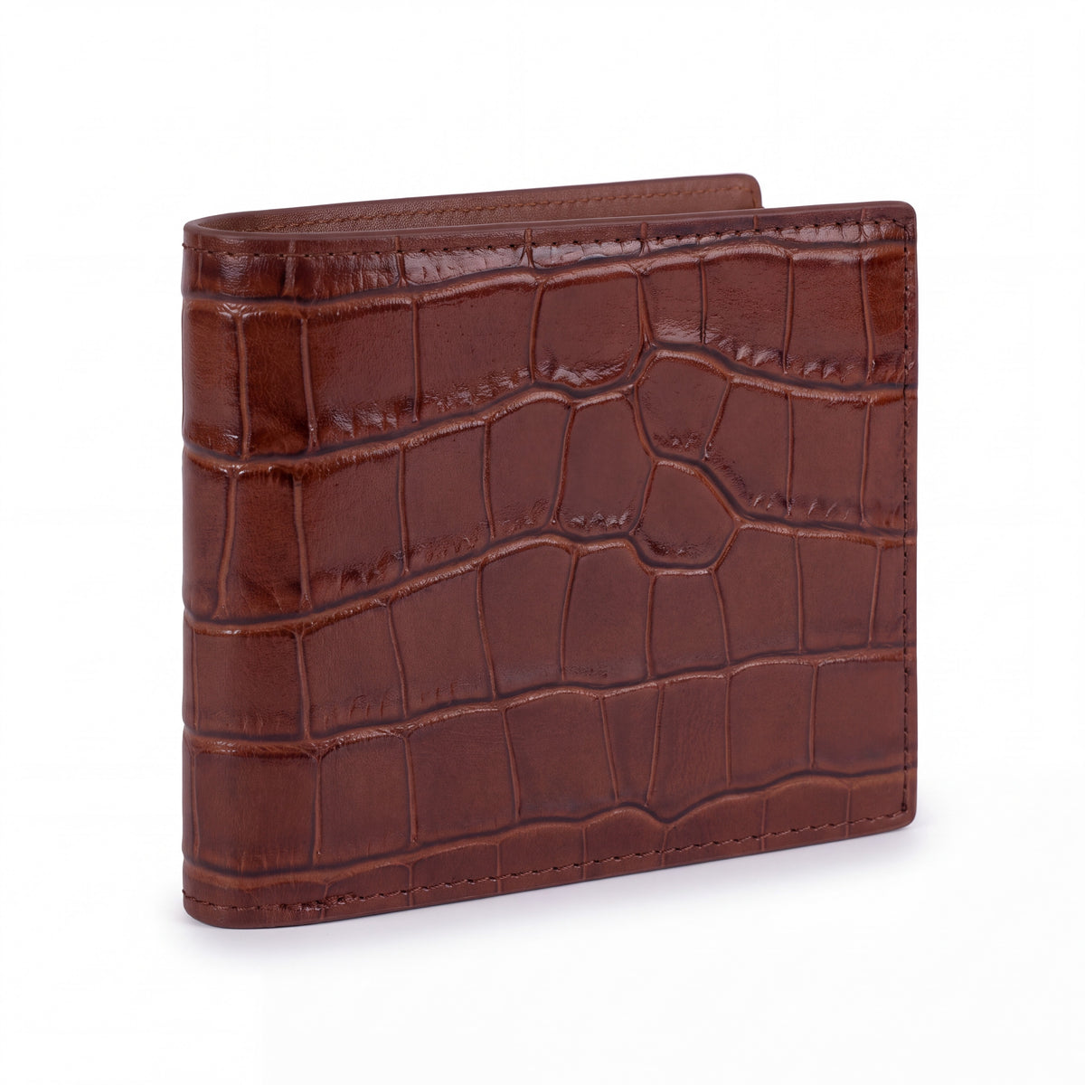 Closed brown crocodile-embossed leather bifold wallet by GENTCREATE standing on white