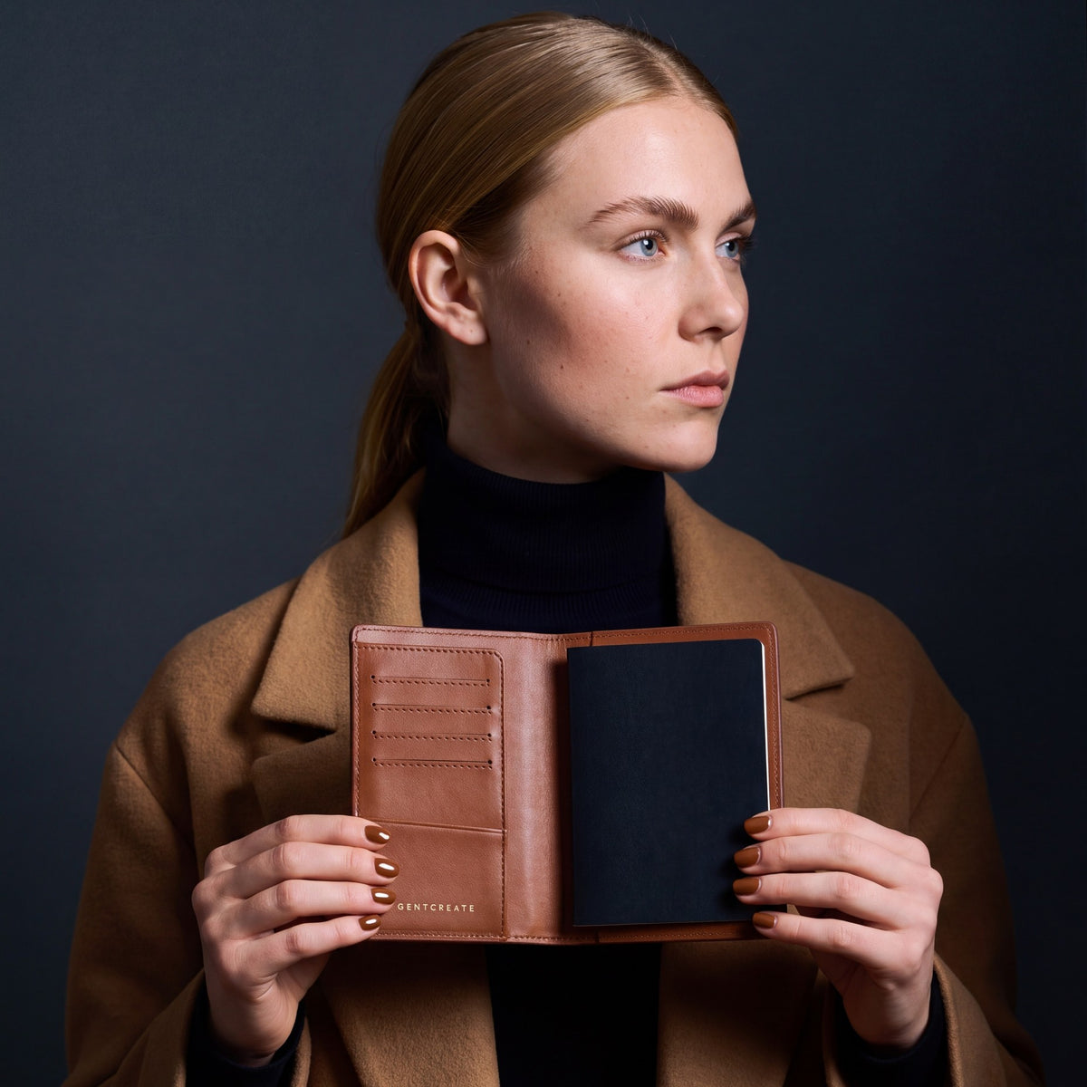 Woman opening a brown crocodile-embossed leather passport holder by GENTCREATE with a passport inside