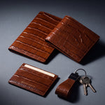 Matching brown crocodile-embossed leather passport holder, wallet, card holder and keychain by GENTCREATE