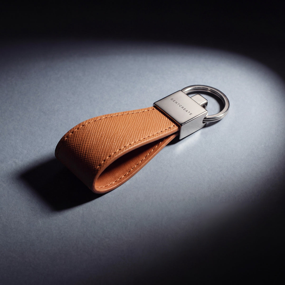 Close-up of the steel clasp of a brown Saffiano leather keychain by GENTCREATE