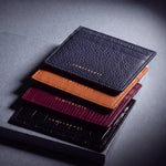 Card holders by GENTCREATE in crocodile-embossed, lizard-embossed, Saffiano and pebble leather, stacked