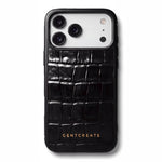 Black glossy crocodile-embossed calfskin iPhone 18 Pro case by GENTCREATE lying at an angle on white