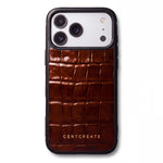 Brown glossy crocodile-embossed calfskin iPhone 18 Pro case by GENTCREATE lying at an angle on white