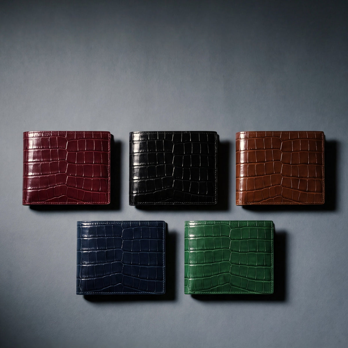 Crocodile-embossed leather bifold wallet by GENTCREATE in burgundy, black, brown, navy and green, laid flat