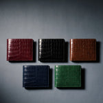 Crocodile-embossed leather bifold wallet by GENTCREATE in burgundy, black, brown, navy and green, laid flat