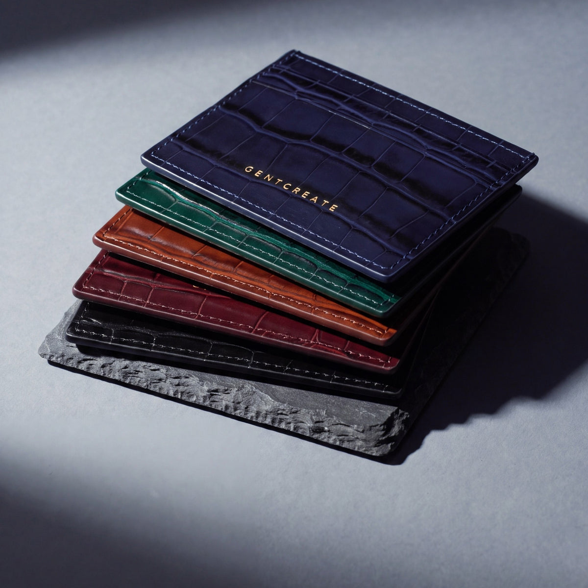 Crocodile-embossed leather card holder by GENTCREATE in black, burgundy, brown, green and navy, stacked