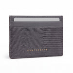 Gray lizard-embossed leather business card holder by GENTCREATE standing on white