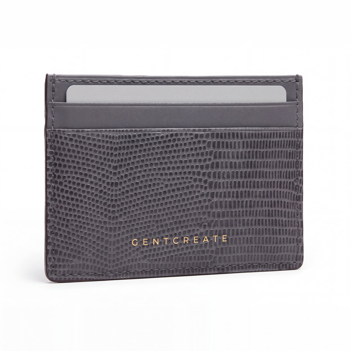 Gray lizard-embossed leather business card holder by GENTCREATE standing on white