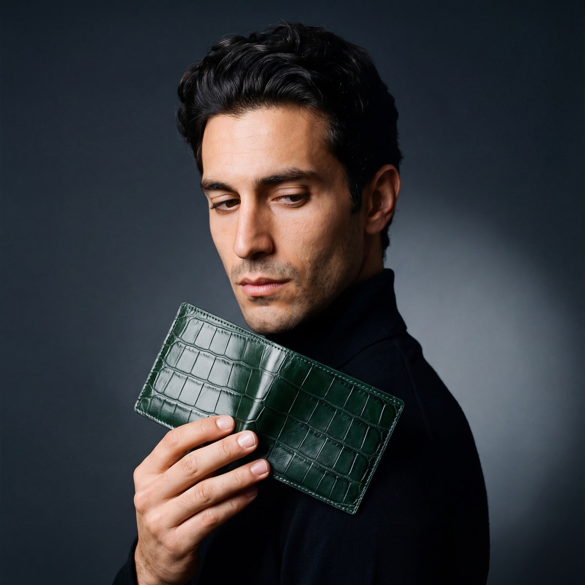 Man holding a green crocodile-embossed leather bifold wallet by GENTCREATE up over the shoulder