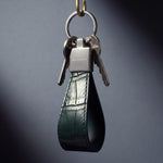 Green crocodile-embossed leather keychain by GENTCREATE, studio still life