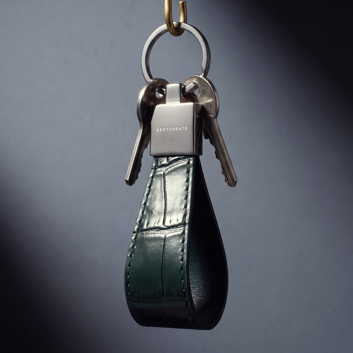 Green crocodile-embossed leather keychain by GENTCREATE, studio still life
