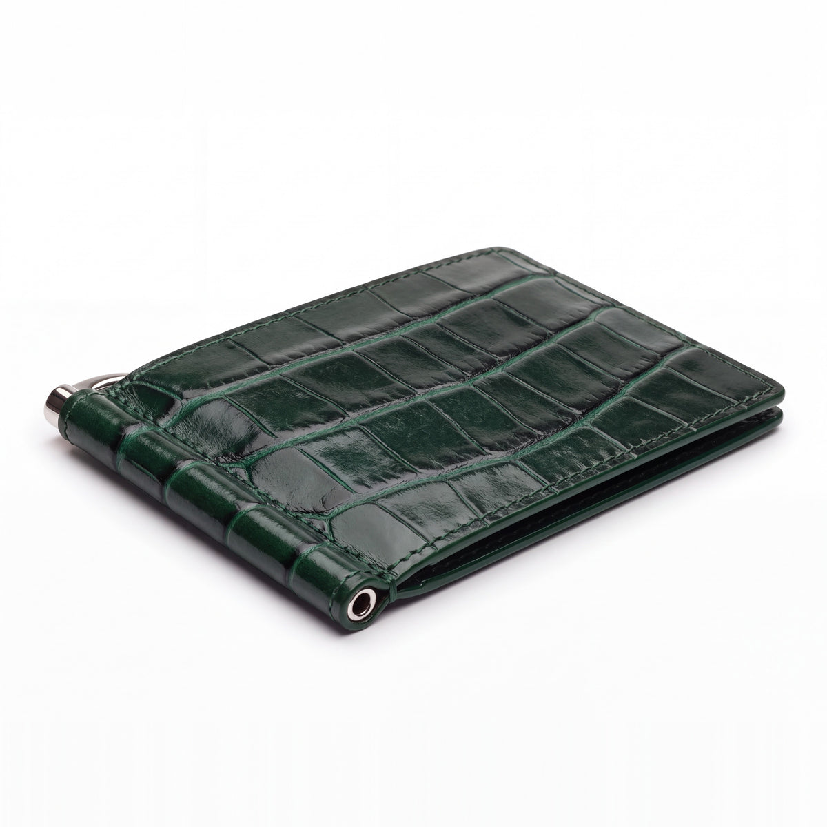 Closed green glossy crocodile-embossed leather money clip wallet by GENTCREATE with its silver clip, on white