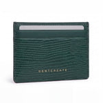 Green lizard-embossed leather business card holder by GENTCREATE standing on white
