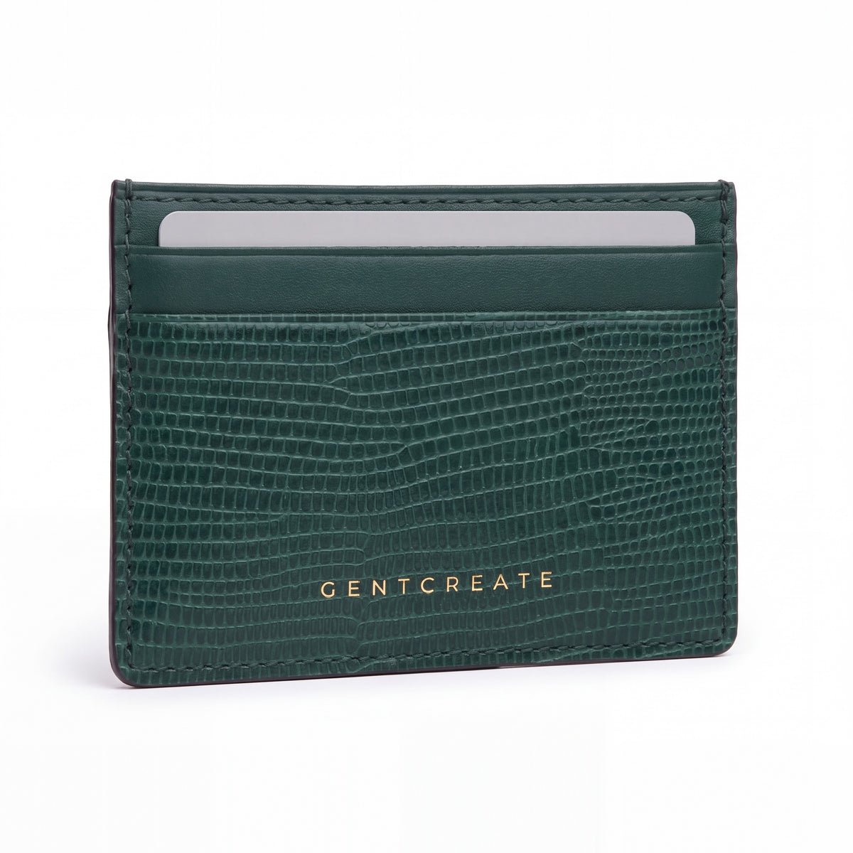 Green lizard-embossed leather business card holder by GENTCREATE standing on white