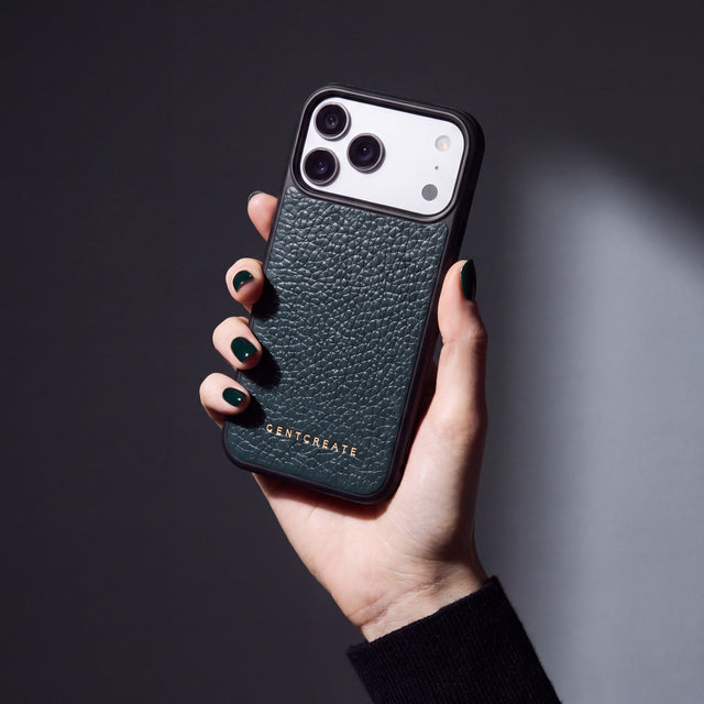 Hand with green nails holding a green pebble-grain calfskin iPhone 18 Pro Max case by GENTCREATE