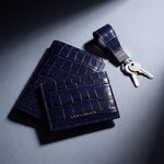 Matching navy crocodile-embossed leather passport holder, card holder and keychain by GENTCREATE