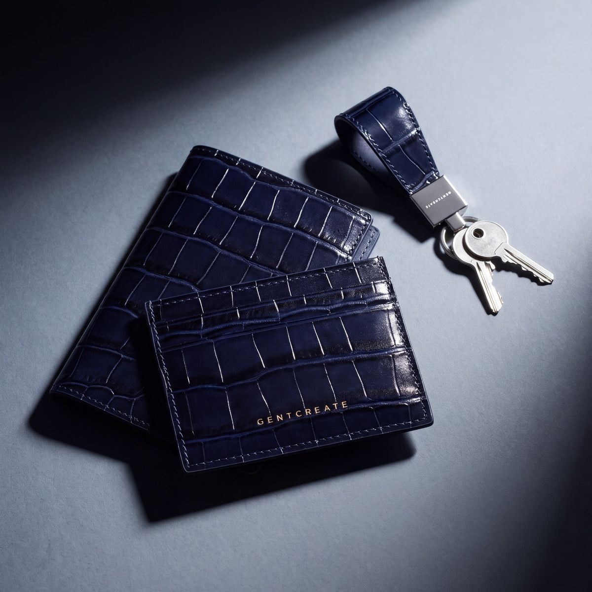 Matching navy crocodile-embossed leather passport holder, card holder and keychain by GENTCREATE