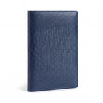 Closed navy lizard-embossed leather passport holder by GENTCREATE standing on white