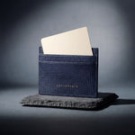 Navy lizard-embossed leather card holder by GENTCREATE, studio still life