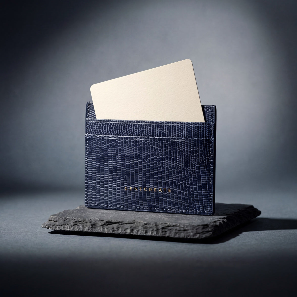 Navy lizard-embossed leather card holder by GENTCREATE, studio still life