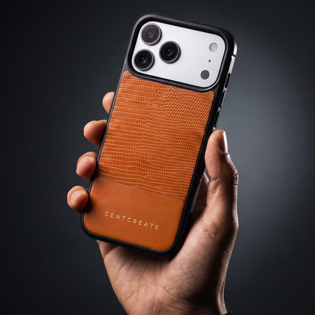 Hand holding an orange lizard-embossed leather iPhone 18 Pro Max case by GENTCREATE in a single studio light
