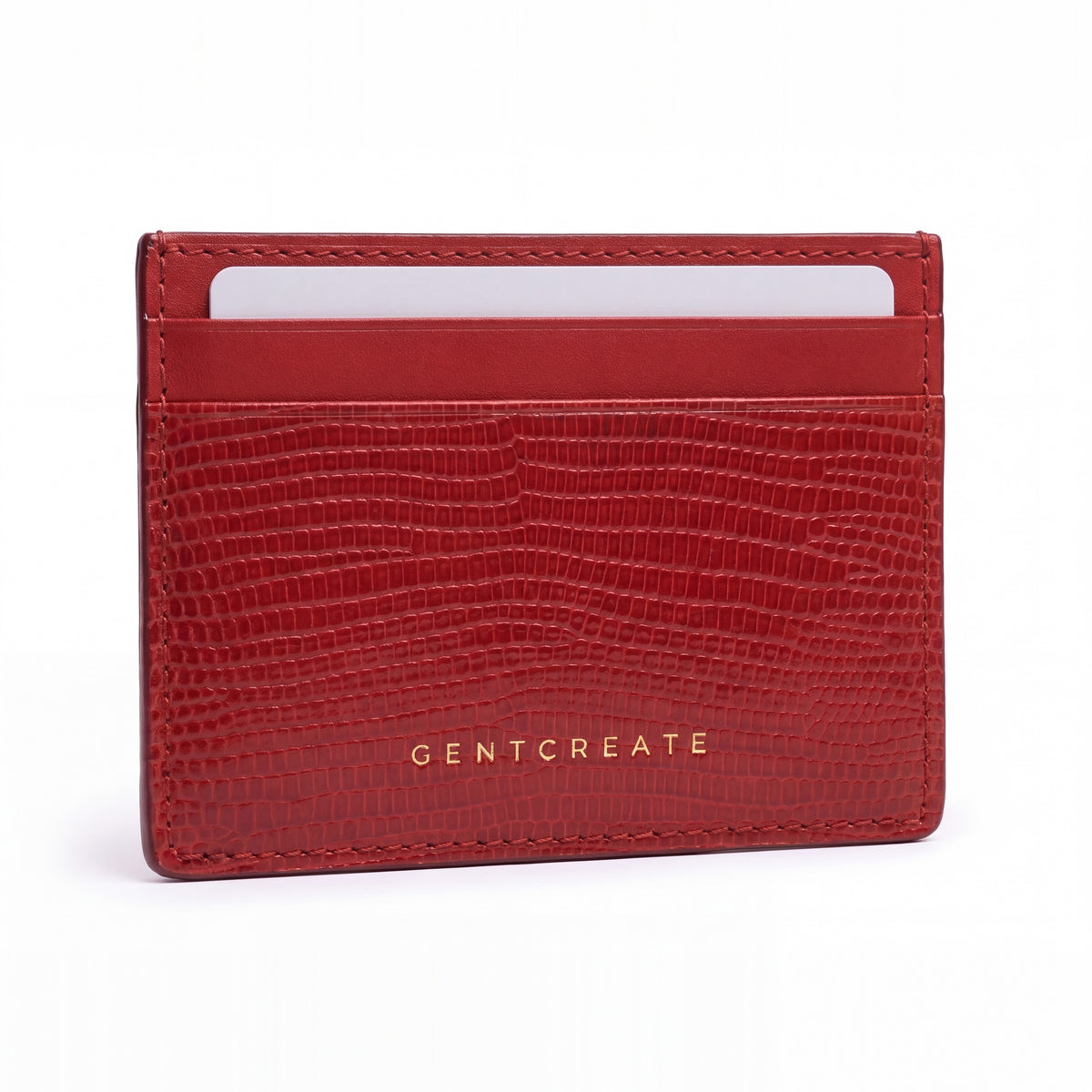 Red lizard-embossed leather business card holder by GENTCREATE standing on white