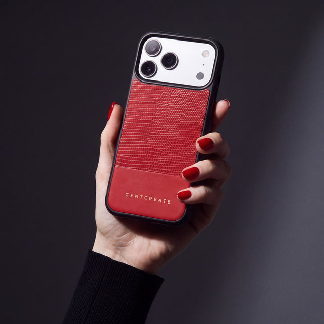 Hand with scarlet nails holding a red lizard-embossed calfskin iPhone 18 Pro Max case by GENTCREATE