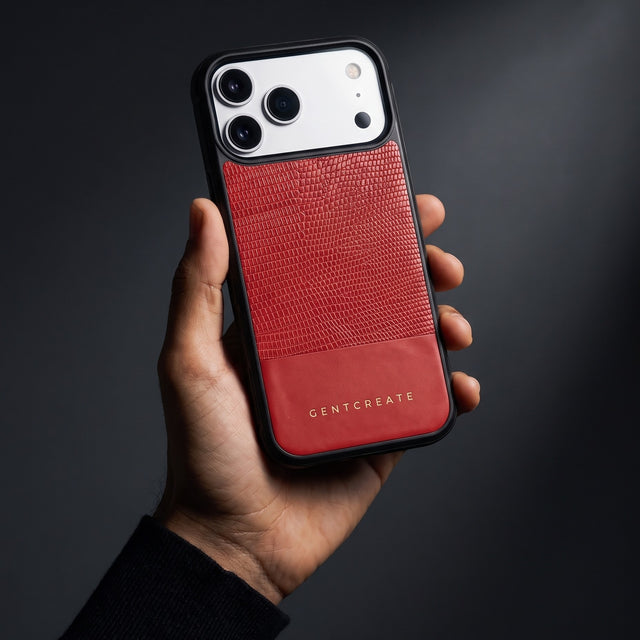 Hand holding a red lizard-embossed leather iPhone 18 Pro Max case by GENTCREATE in a single studio light